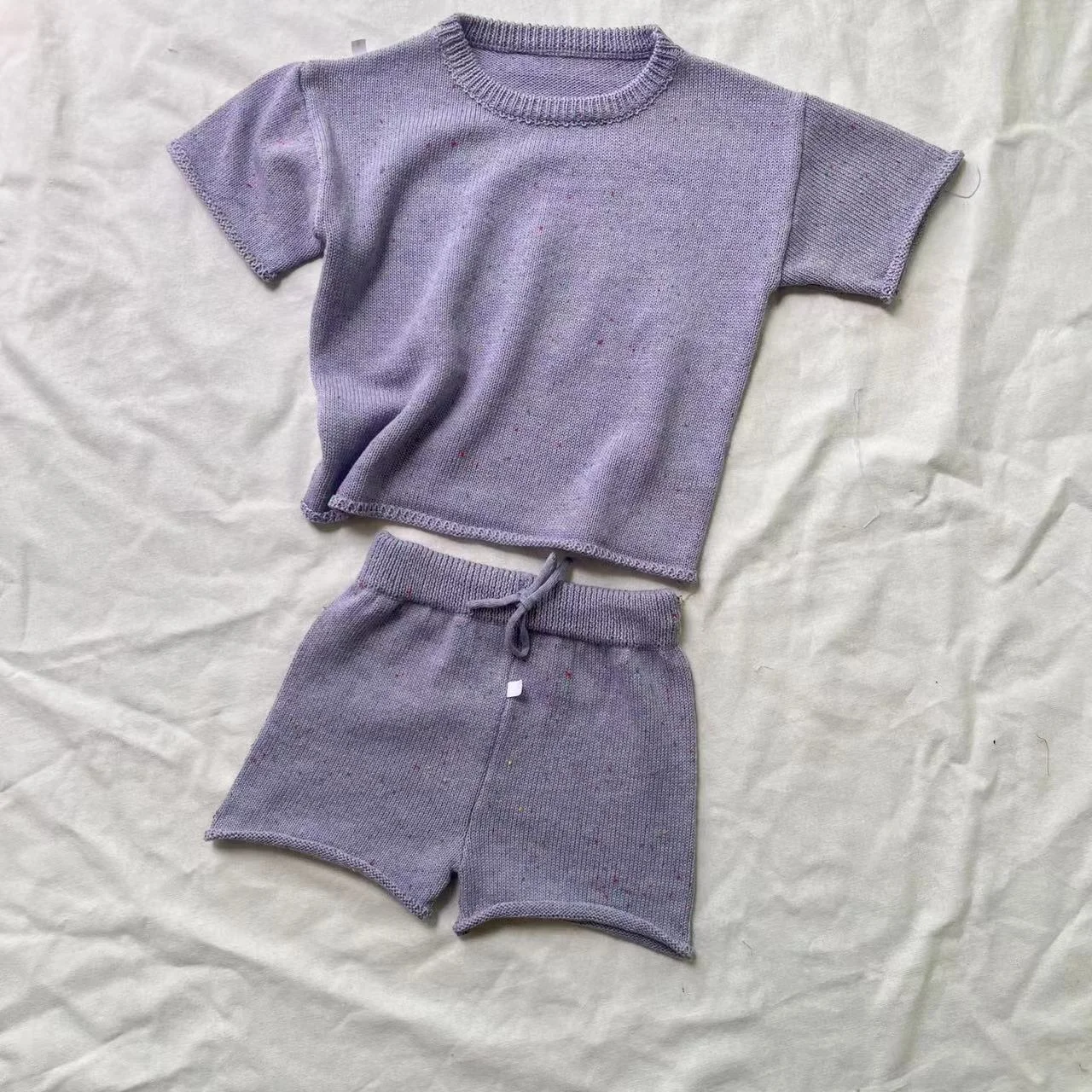 Soft bamboo baby clothes displayed for B2B wholesale buyers, highlighting eco-friendly, sustainable materials ideal for retail businesses.